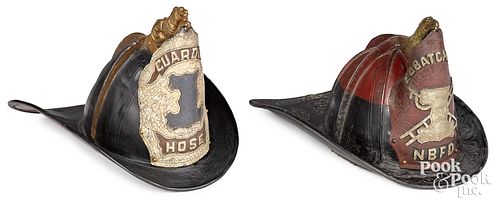 TWO PAINTED LEATHER FIRE HELMETS  31341e