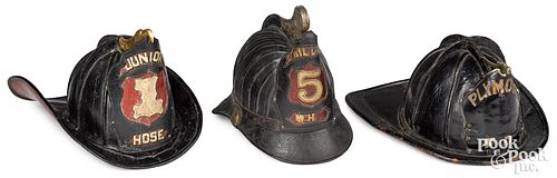 THREE PAINTED LEATHER FIRE HELMETS  313420