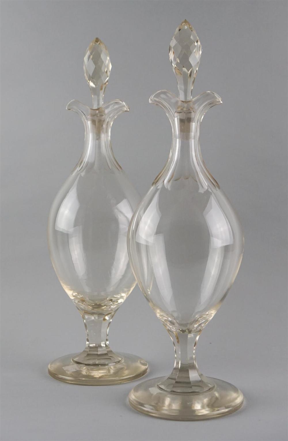 PAIR OF TALL GLASS DECANTERS AND