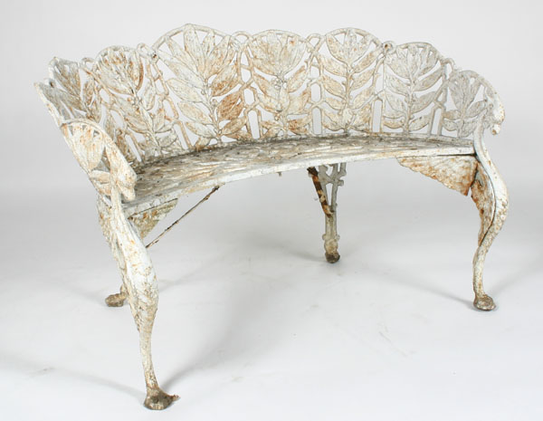 Ornate white cast iron bench, arms ending