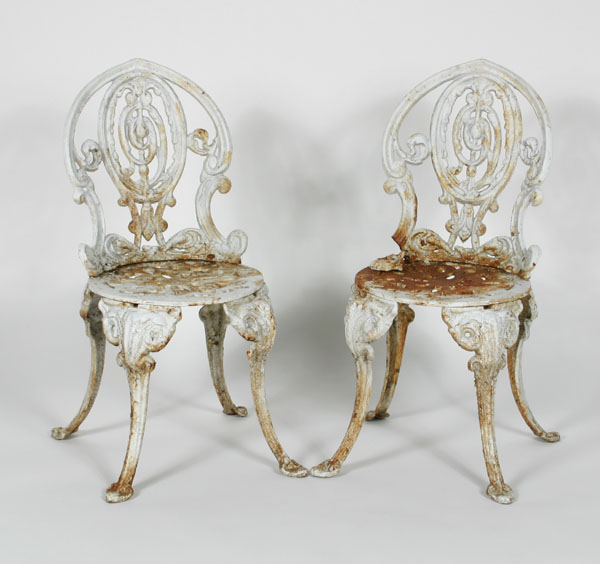 A pair of cast iron garden seats