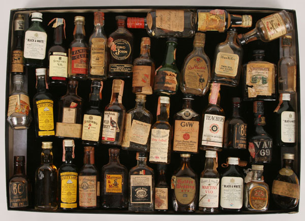 Thirty plus whiskey bottles including