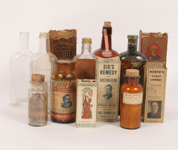 Medicine bottles: two embossed with