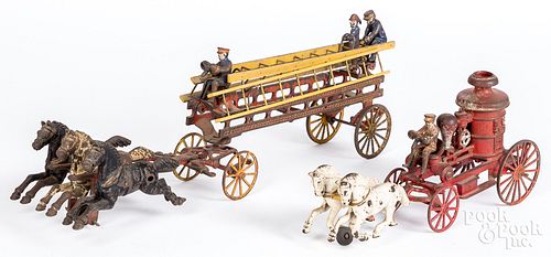 TWO CAST IRON HORSE DRAWN FIRE WAGONSTwo