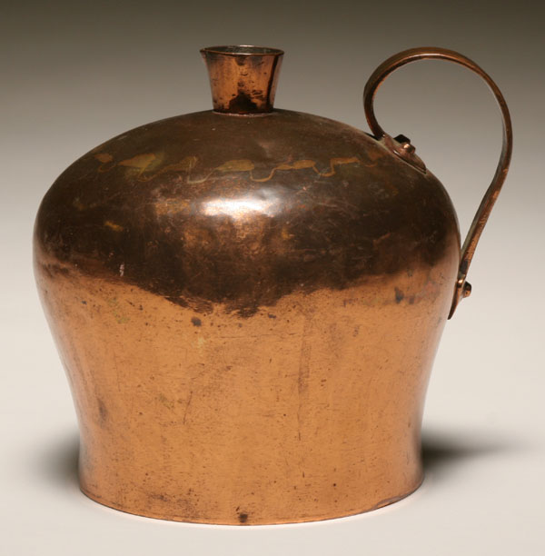 Early copper jug with strap handle;