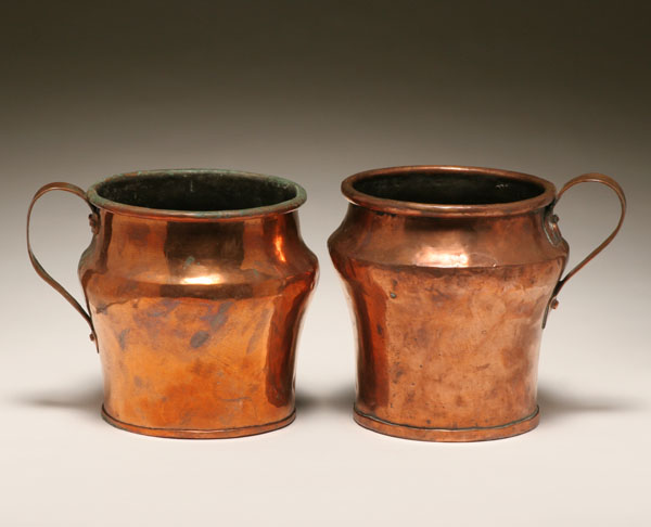 Pair early copper pots with handles;