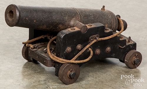 CAST IRON SIGNAL CANNON, ON A WOOD