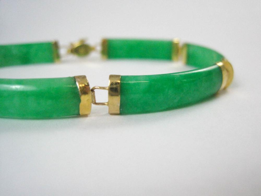 GREEN JADE AND FOURTEEN KARAT GOLD