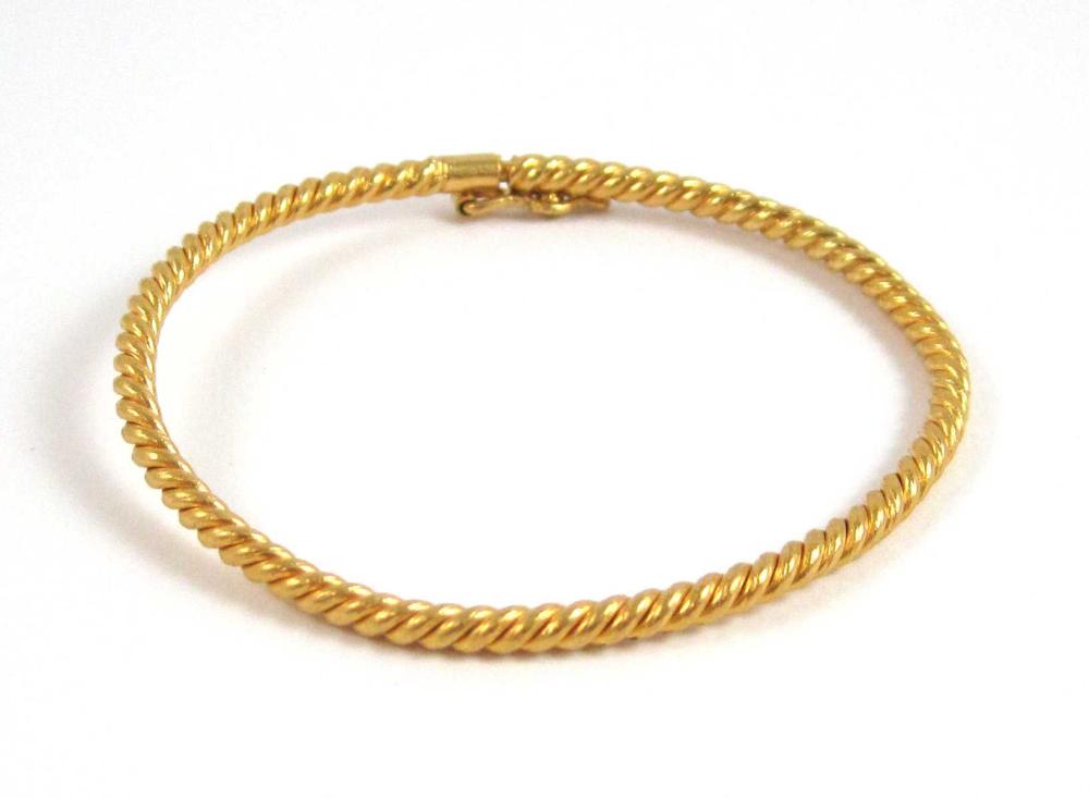 TWENTY FOUR KARAT YELLOW GOLD BANGLE  313e83