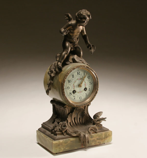 Key wind marble clock with cherub mount: