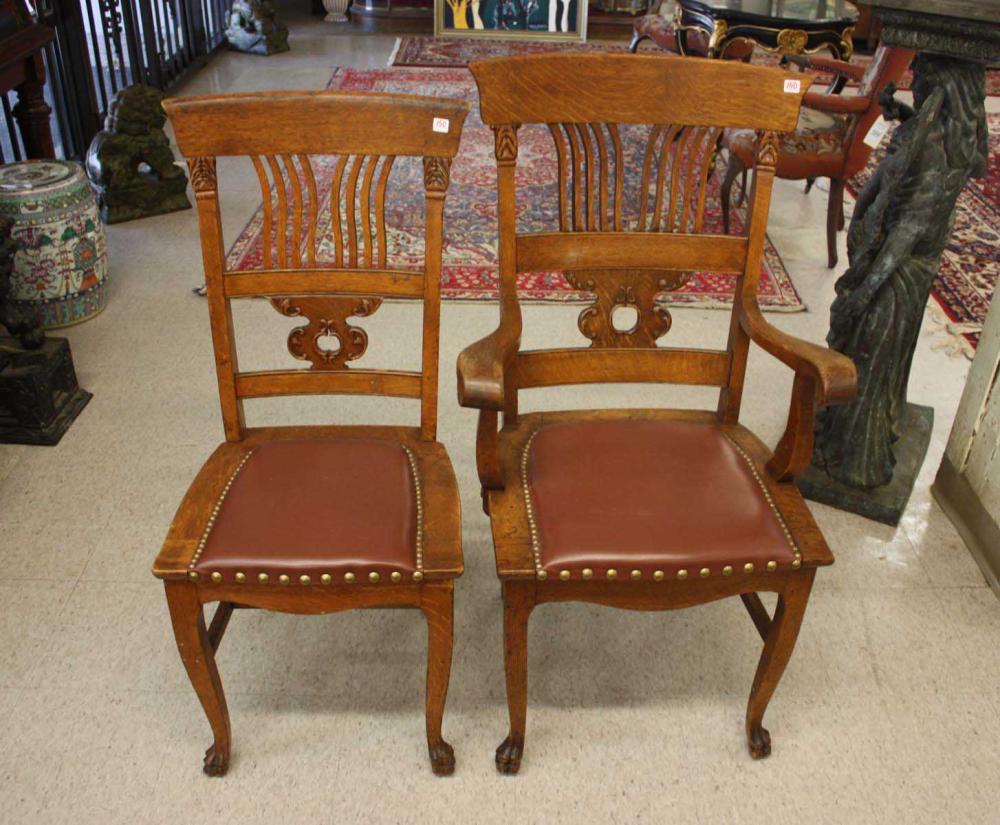 A SET OF SEVEN OAK DINING CHAIRS,