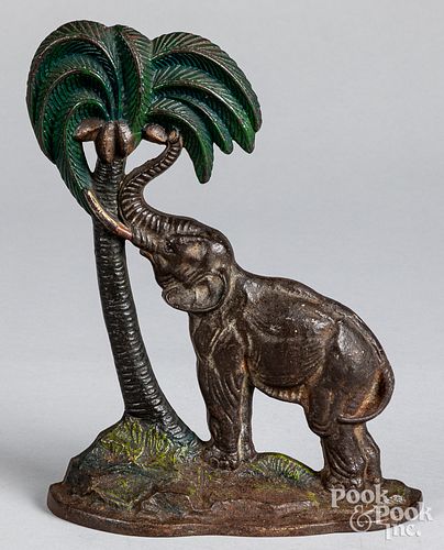 CAST IRON ELEPHANT AND PALM DOORSTOPA.