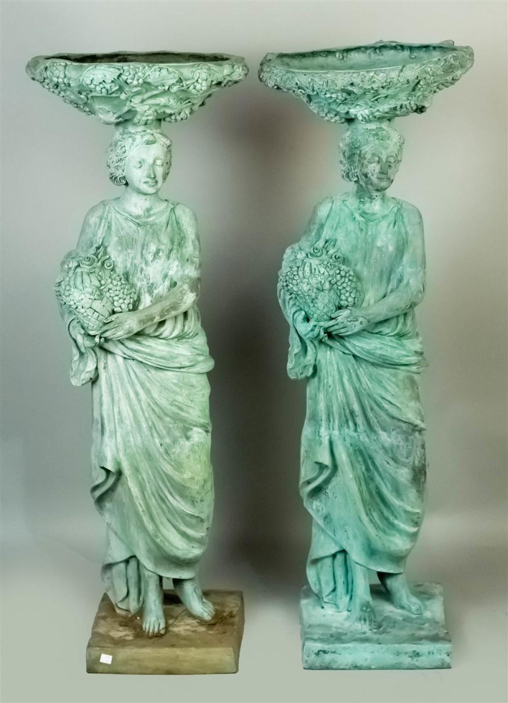 TWO PATINATED METAL CARYATID BIRD