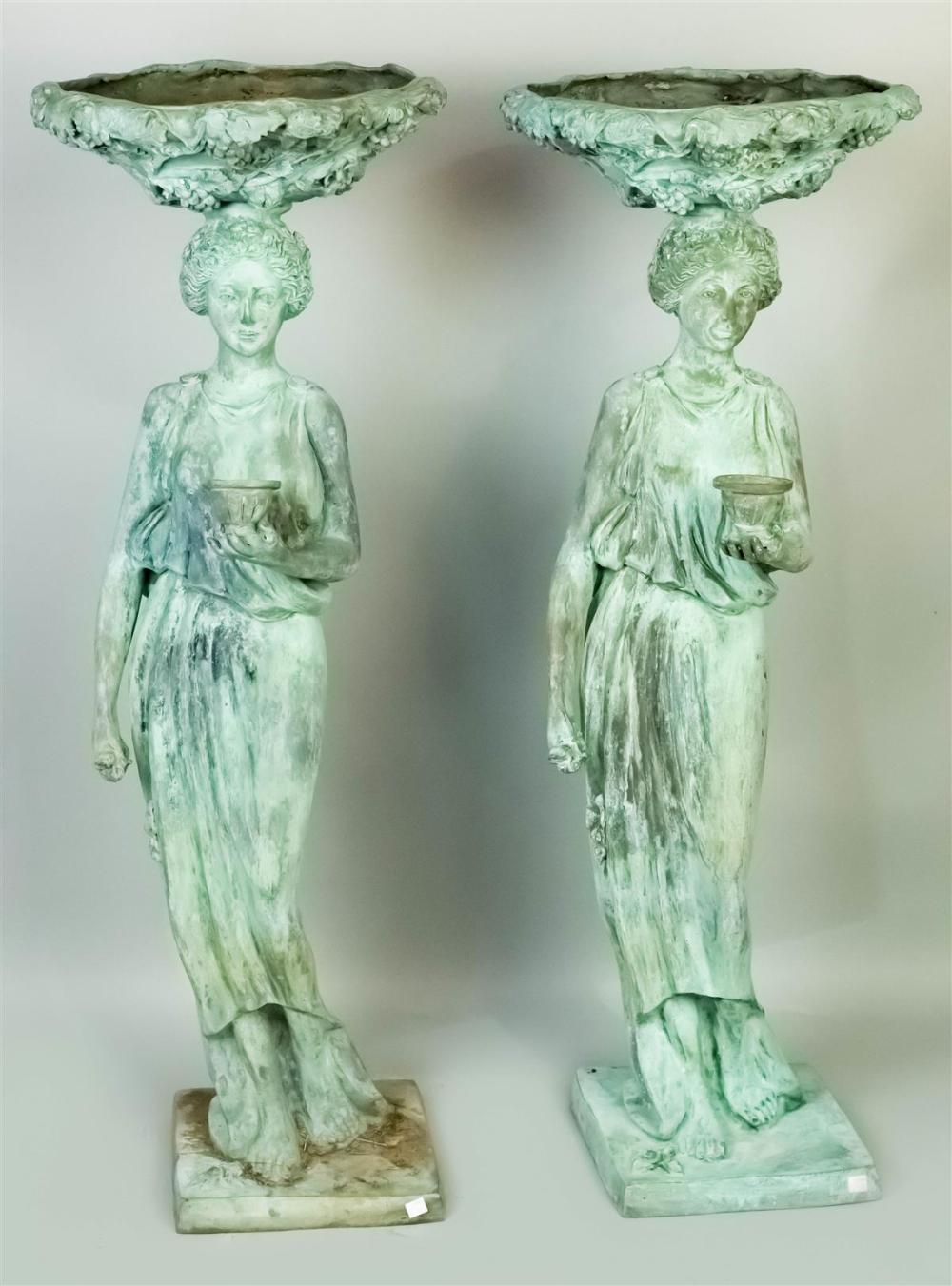 TWO PATINATED METAL CARYATID BIRD