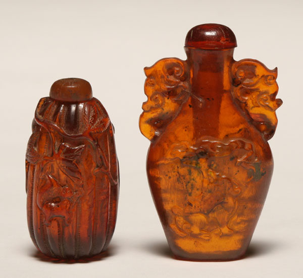 Two Chinese carved amber snuff