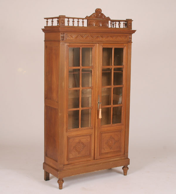 Victorian glass front bookcase; beveled