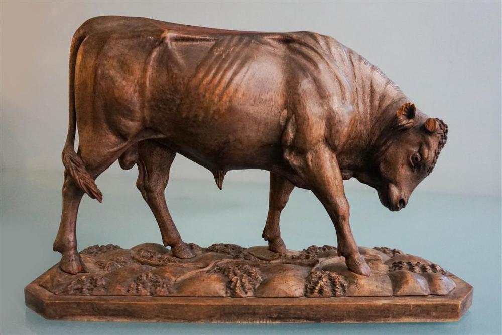 CARVED WOOD MODEL OF A COWCARVED