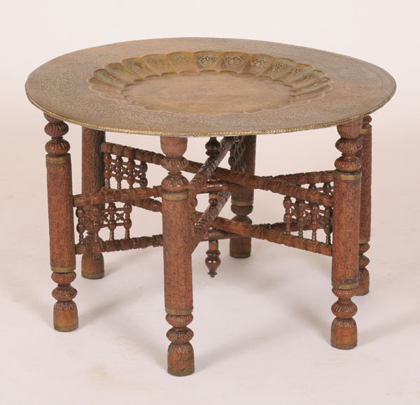 Embossed brass tray table with carved