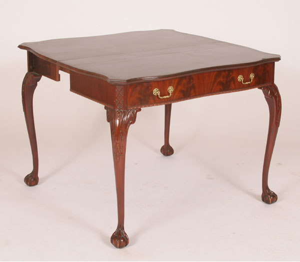 Mahogany game table; claw and ball