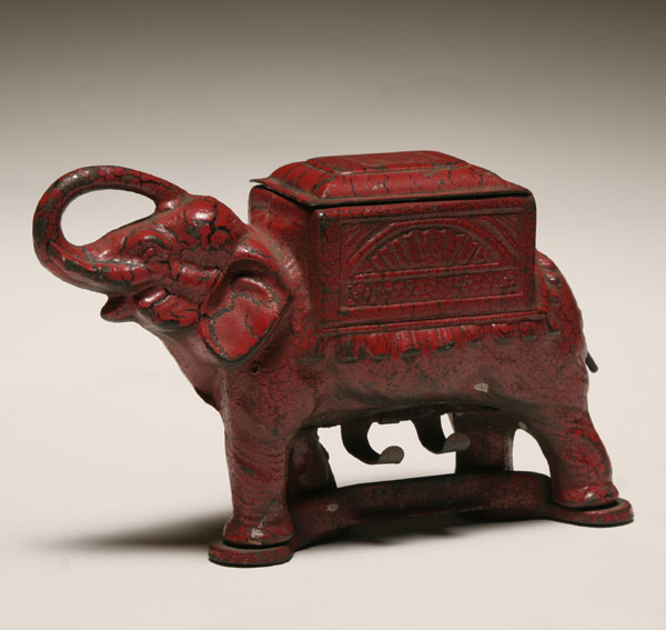 Cast iron elephant mechanical roller/dispenser;