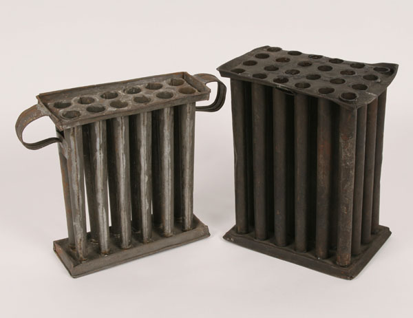 A pair of antique primitive tin