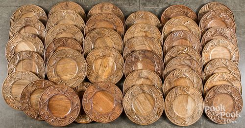 THIRTY-EIGHT CARVED WOOD PLATES,