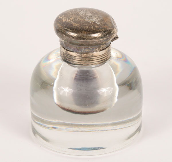 An inkwell/paperweight, monogrammed