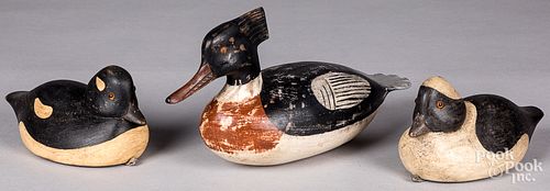 THREE CARVED AND PAINTED DUCK DECOYSThree 31315f