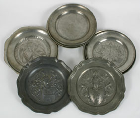 Eleven pewter plates and bowls;