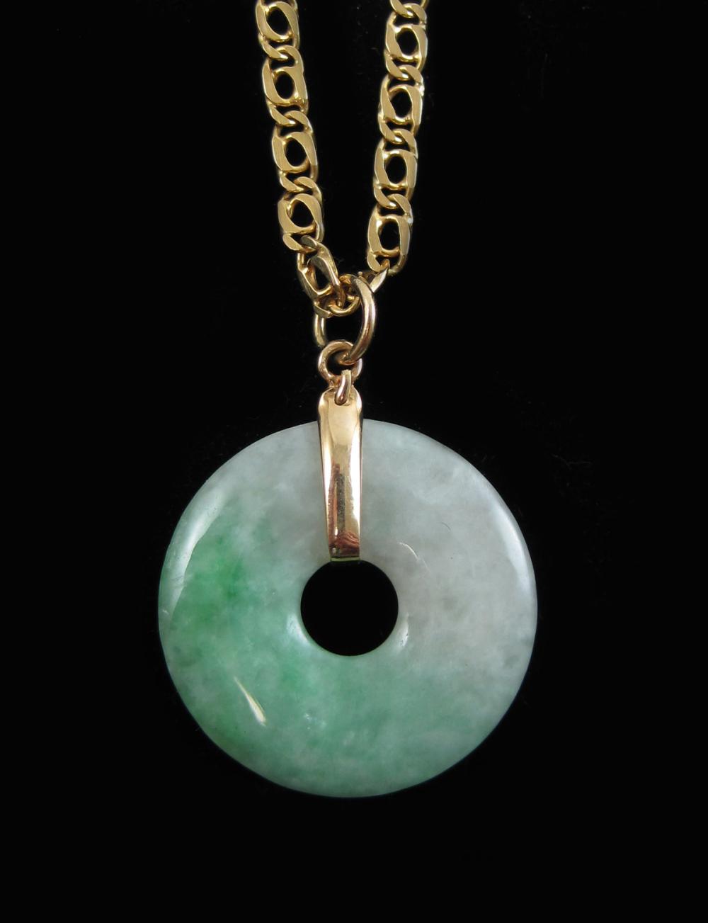 JADE AND FOURTEEN KARAT GOLD PENDANT