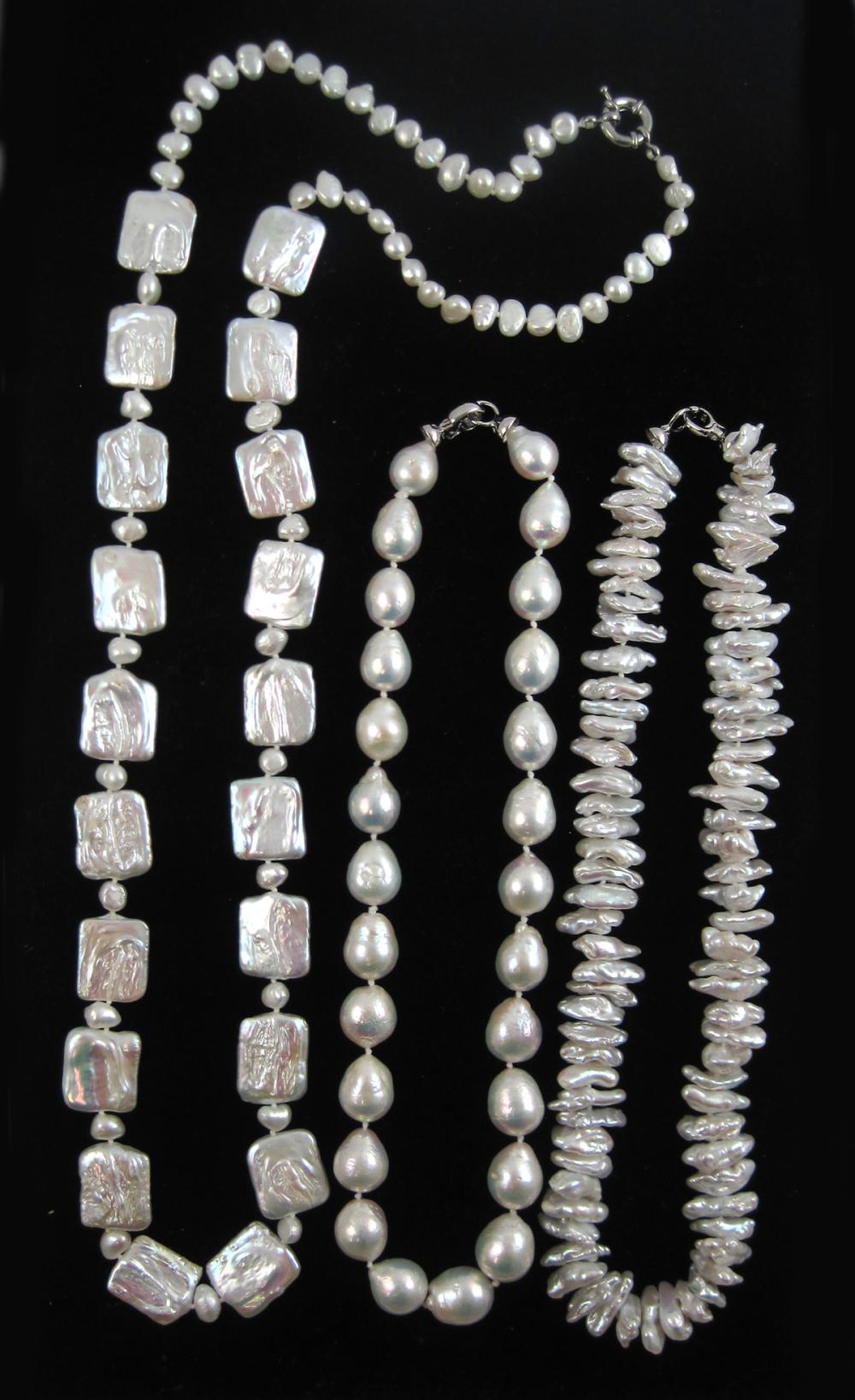 THREE BAROQUE WHITE PEARL NECKLACES,