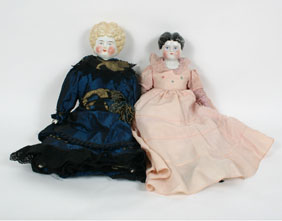 Lot of 2 molded hair china dolls;