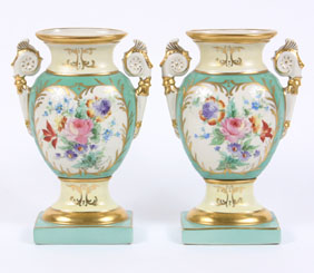 A pair of hand painted mantle urns,