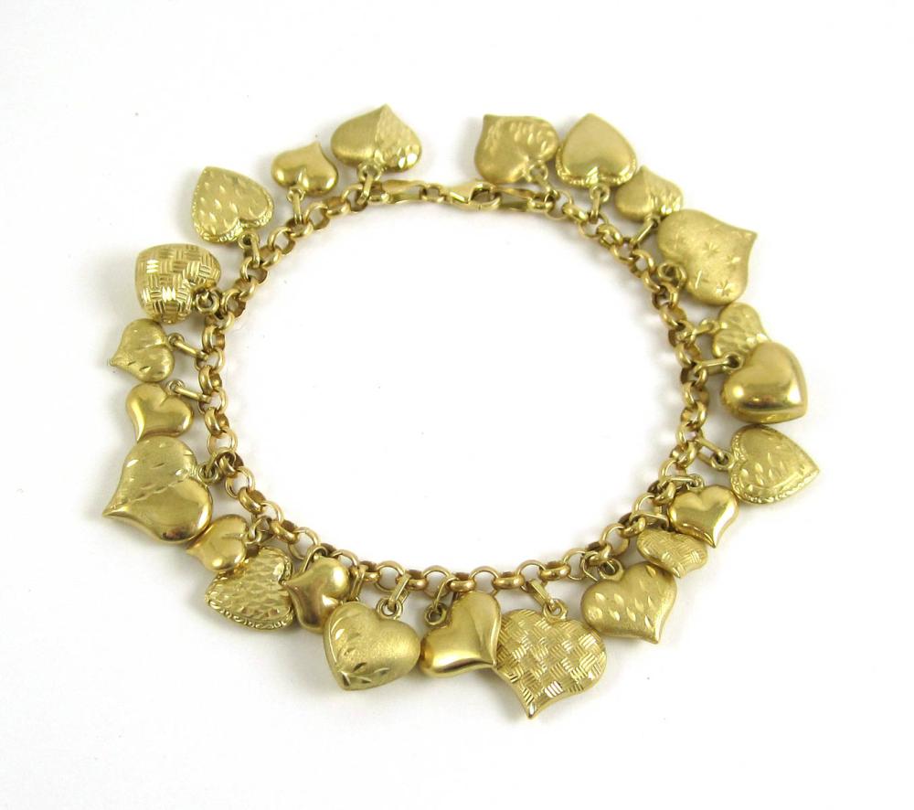 FOURTEEN KARAT GOLD CHARM BRACELET  315cdc