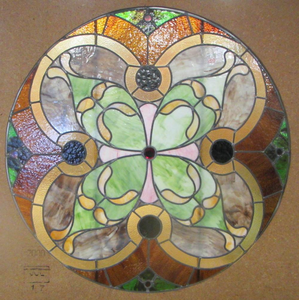 A ROUND STAINED AND LEADED GLASS 316010