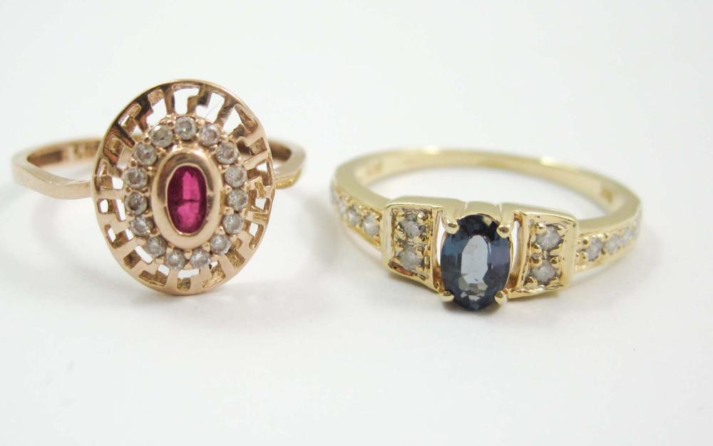 TWO FOURTEEN KARAT GOLD RINGS: