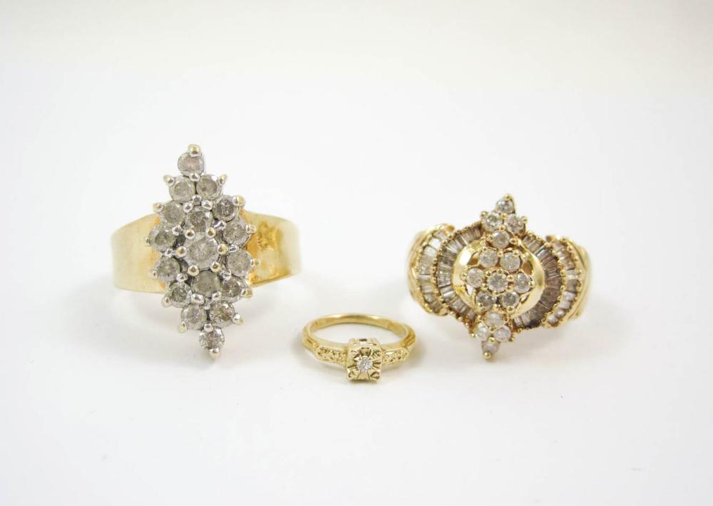 THREE DIAMOND AND YELLOW GOLD RINGS,