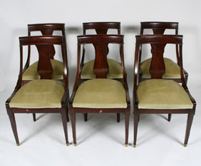 Set of six mahogany dining chairs; curved