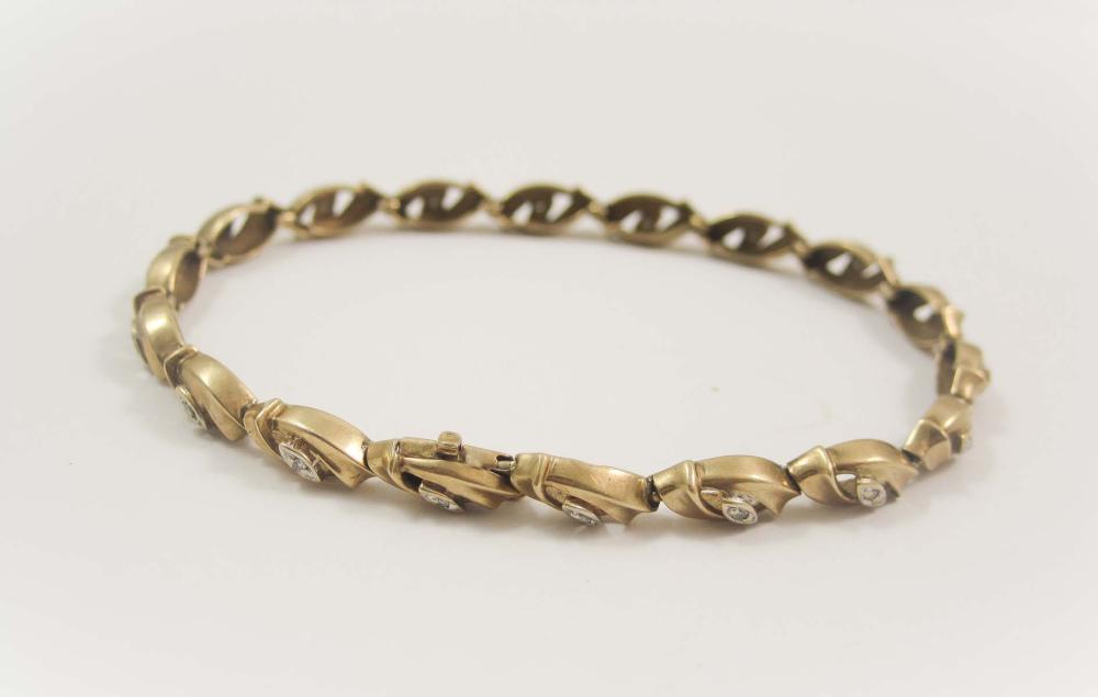 DIAMOND AND TEN KARAT GOLD BRACELET,