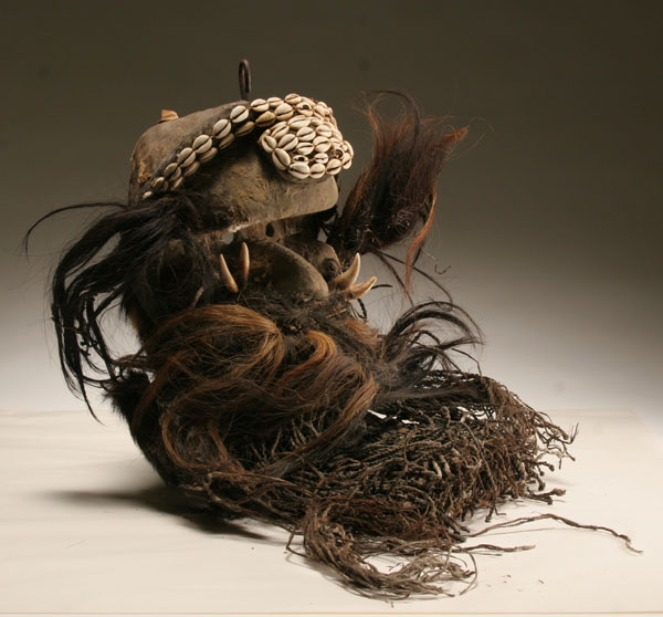 African carved wooden helmet mask, Liberia.