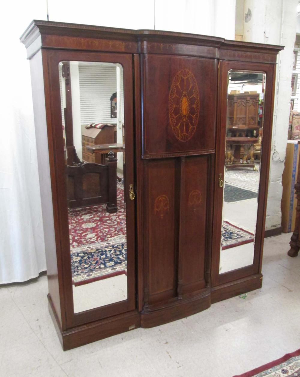 AN EDWARDIAN INLAID MAHOGANY THREE-DOOR