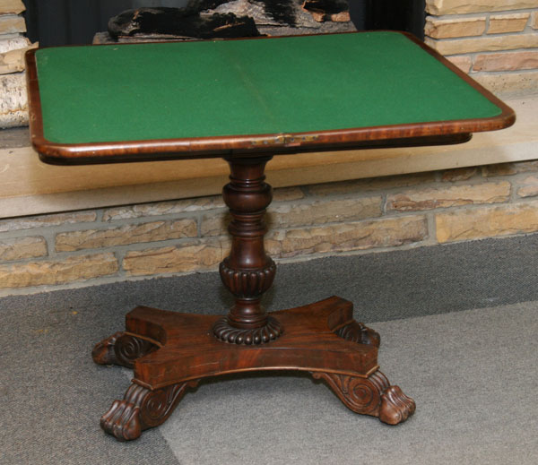 Mahogany tilt top game table, 19th century;