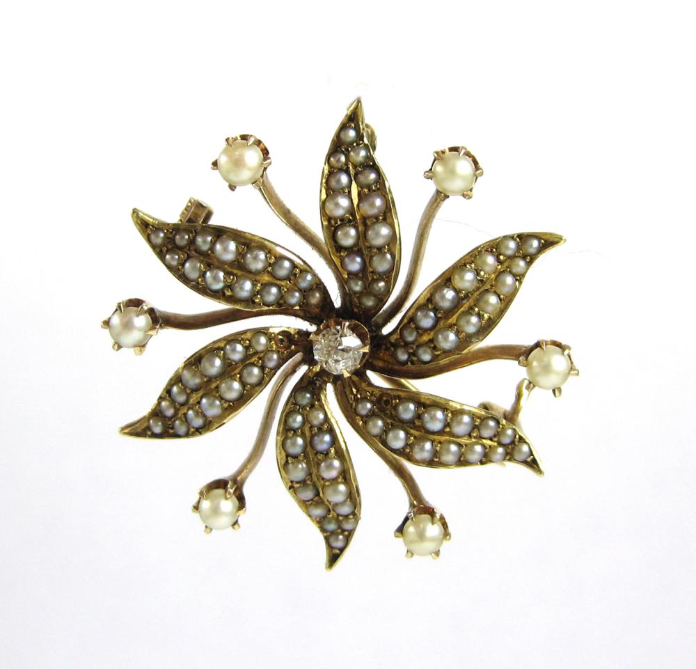 DIAMOND AND FOURTEEN KARAT GOLD FLOWER