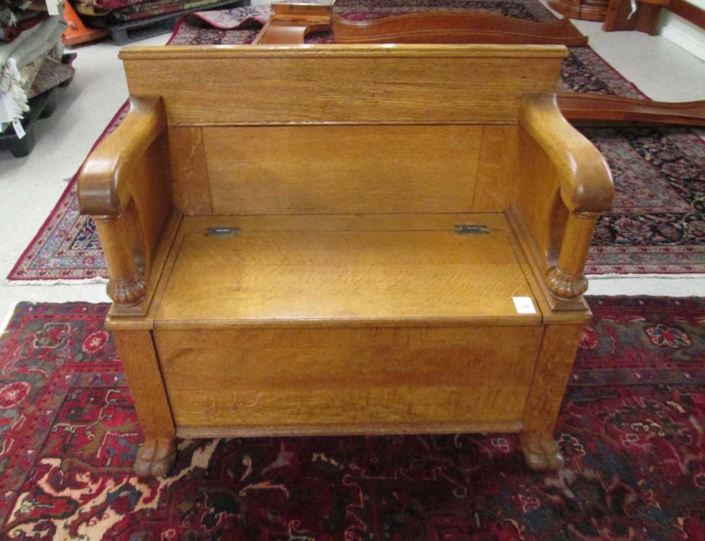 AN OAK LIFT-SEAT STORAGE SETTLE,