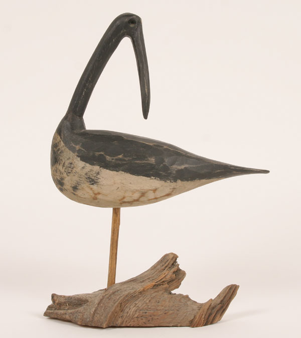 A shorebird chip carved from a