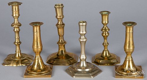 FIVE BRASS CANDLESTICKS, AND A