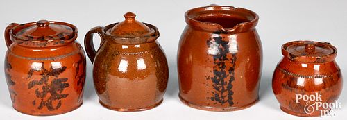 FOUR PENNSYLVANIA REDWARE PITCHERS,