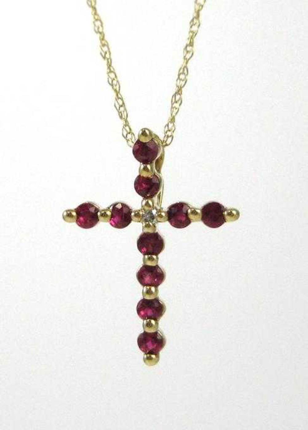 RUBY AND FOURTEEN KARAT GOLD PENDANT 314bab