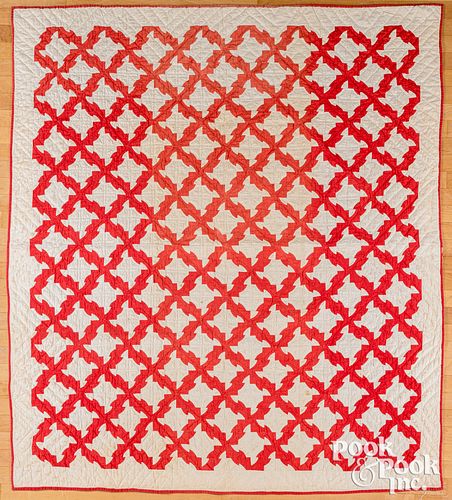 TWO RED AND WHITE PIECED QUILTS,