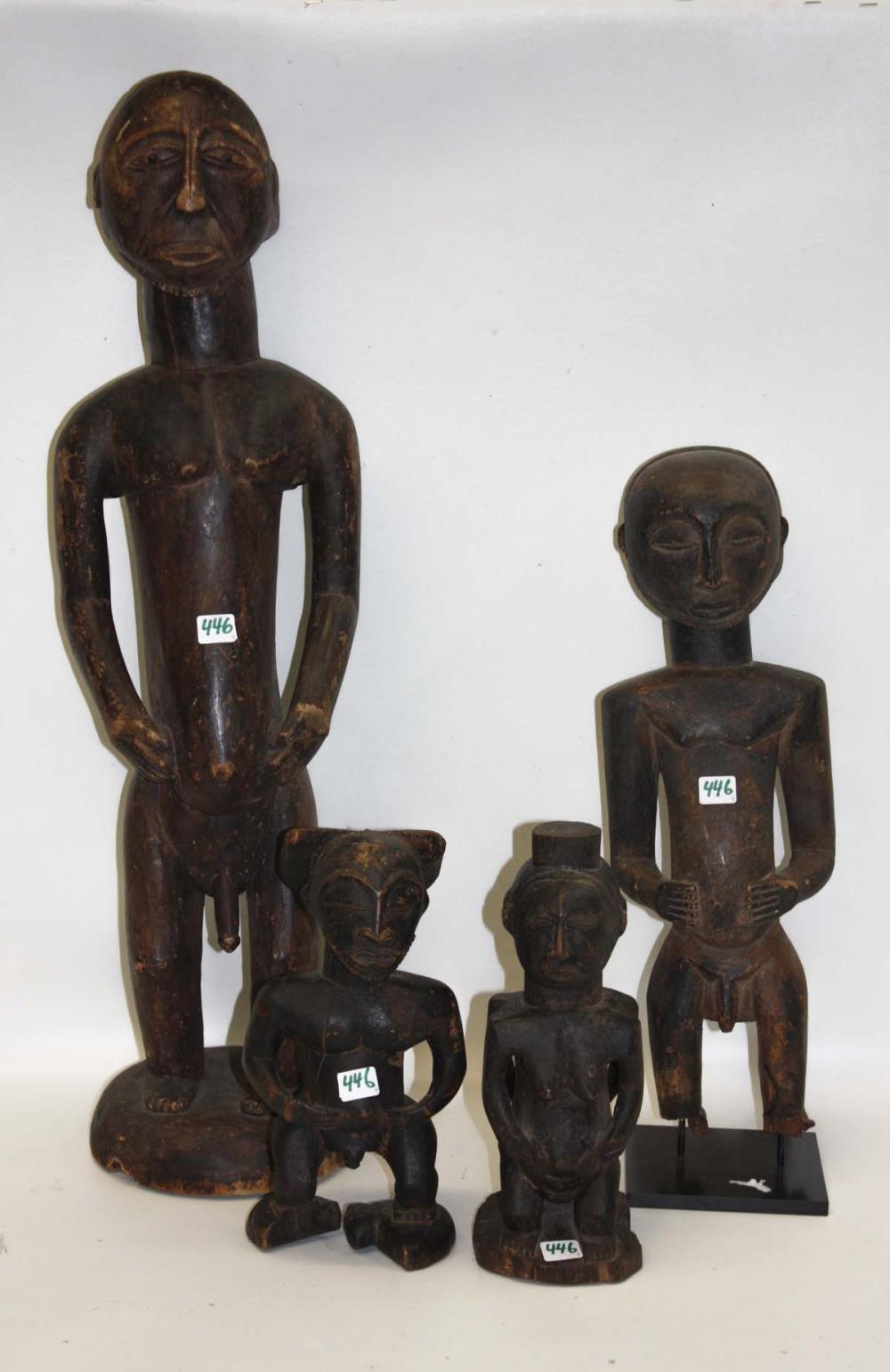 FOUR AFRICAN FIGURAL HEMBA WOOD